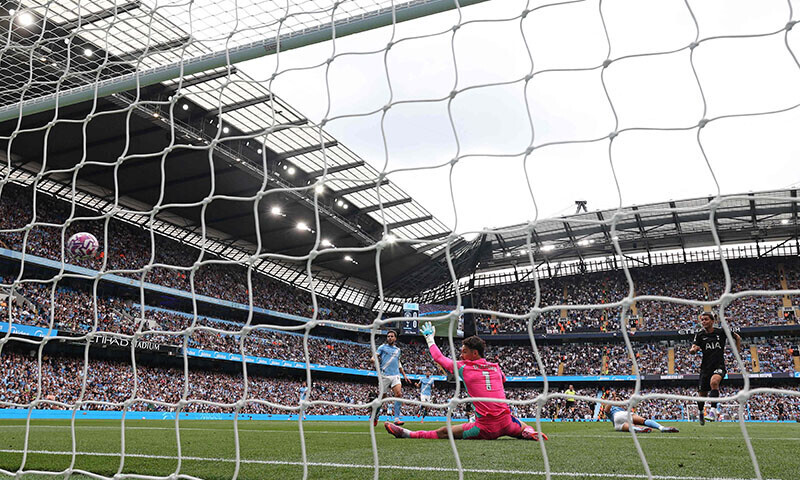 Tottenham Hotspur&rsquo;s Welsh forward Brennan Johnson (R) scores the opening goal during the English Premier League football match against Manchester City at the Etihad Stadium in Manchester, northwest England, August 23. &mdash; AFP