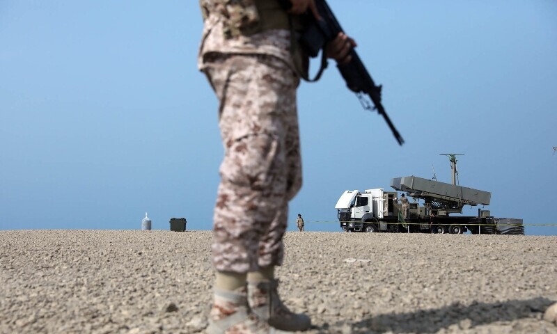 A handout picture provided by the Iranian Army office on August 21, 2025, shows a a soldier standing near a rocket launcher during a military drill in an undisclosed location in southern Iran. &mdash; AFP