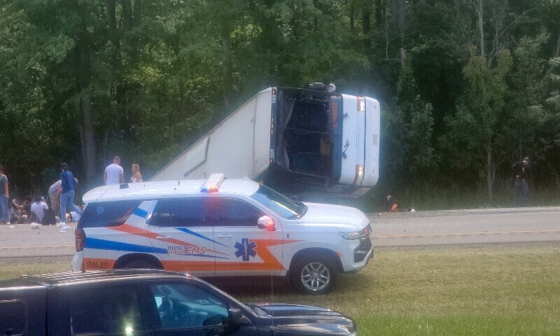 This photo received courtesy of Mike Flaig shows victims and emergency personnel at the site of a bus crash on Interstate 90 eastbound near Pembroke, New York, on August 22. &mdash; AFP