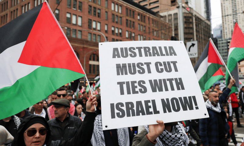 A demonstrator holds a placard as they take part in the ‘Nationwide March for Palestine’ protest in Sydney, Australia on August 24, 2025. — Reuters/Hollie Adams