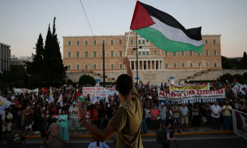  A pro-Palestinian protester waves a Palestinian flag in front of the Greek Parliament during a demonstration in support of Palestinians in Gaza, amid the ongoing conflict between Israel and Hamas, at Syntagma Square in Athens, Greece on August 24, 2025. &mdash; Reuters 