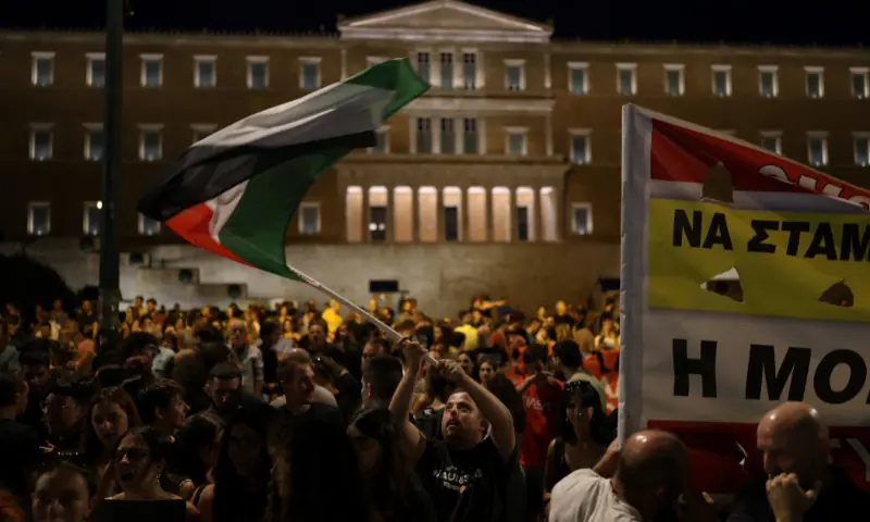  A pro-Palestinian protester waves a Palestinian flag in front of the Greek Parliament during a demonstration in support of Palestinians in Gaza, amid the ongoing conflict between Israel and Hamas, at Syntagma Square in Athens, Greece on August 24, 2025. &mdash; Reuters 
