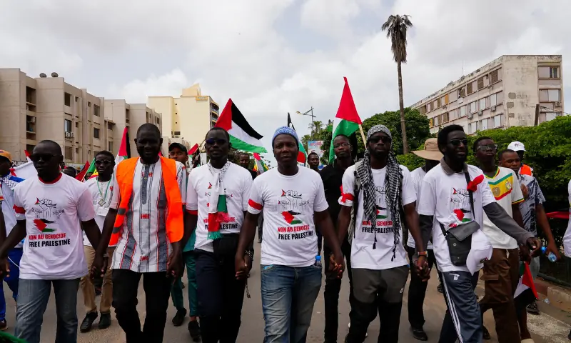  People hold hands during a protest in solidarity with Palestinians and Gaza, organised by a civil society group, in Dakar, Senegal on August 24, 2025. &mdash; Reuters 