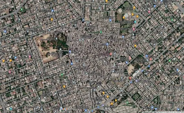 Low-income informally planned Charar Pind housing colony amidst the upper-class DHA housing development.