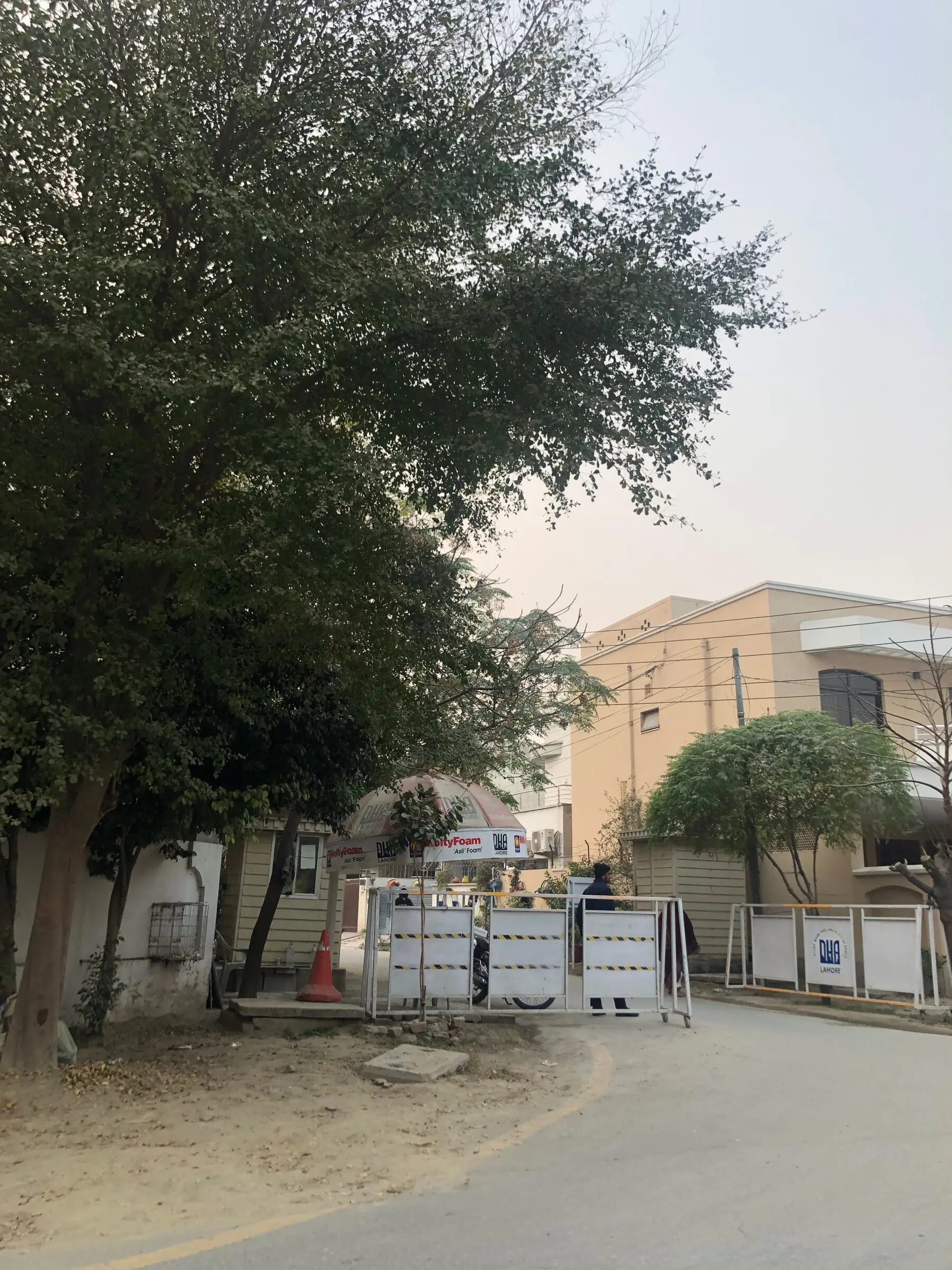 Barricaded entrance from Charar Pind into DHA. Source: IJURR journal paper