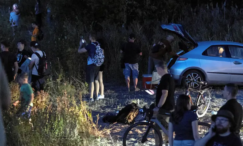 People stand near the scene where a Polish Air Force F-16 fighter jet crashed during a rehearsal for an airshow, in Radom, Poland August 28, 2025. &mdash; Agencja Wyborcza.pl/Marcin Kucewicz via Reuters