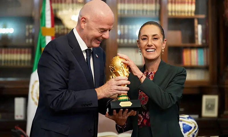 Mexican President Claudia Sheinbaum and FIFA president Gianni Infantino hold the FIFA World Cup trophy at the National Palace, in Mexico City, Mexico on August 28, 2025. &mdash; Reuters