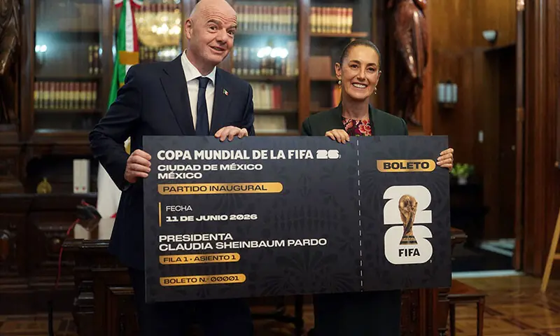 Handout picture released By Mexican Presidency shows Mexico&rsquo;s President Claudia Sheinbaum and FIFA President Gianni Infantino pose for pictures with a giant ticket at the National Palace in Mexico City on August 28, 2025. &mdash; AFP