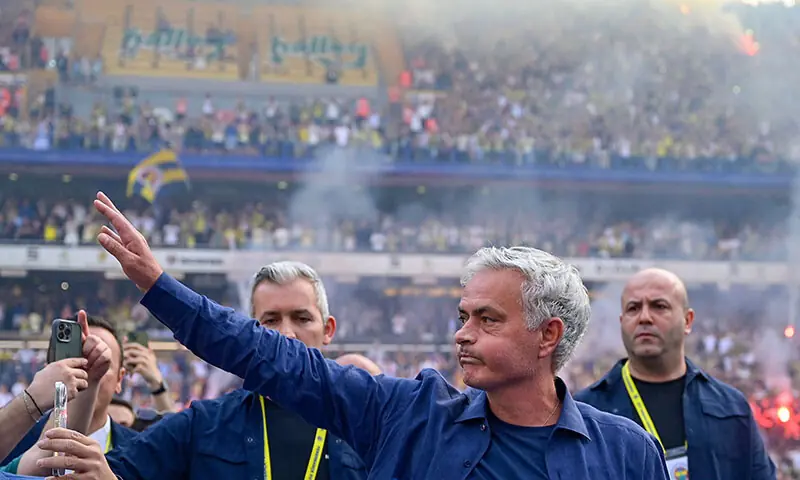 New coach of Turkish club Fenerbahce Jose Mourinho (C) waves during the presentation to the supporters at the Sukru Saracoglu Stadium in Istanbul on June 2, 2024. &mdash; AFP/File