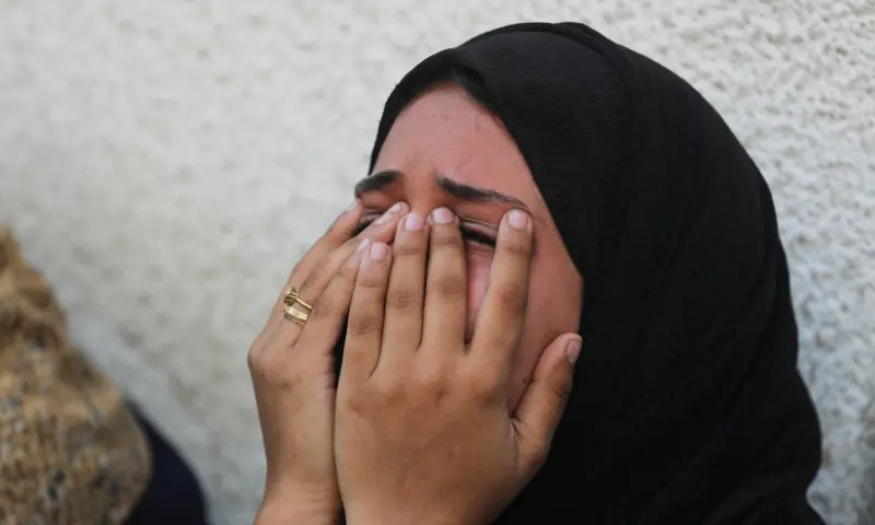 A mourner reacts during the funeral of Palestinians who were killed by Israeli fire while trying to receive aid and another killed in a strike on Friday, according to medics, at Al-Shifa Hospital in Gaza City, on August 30. &mdash; Reuters