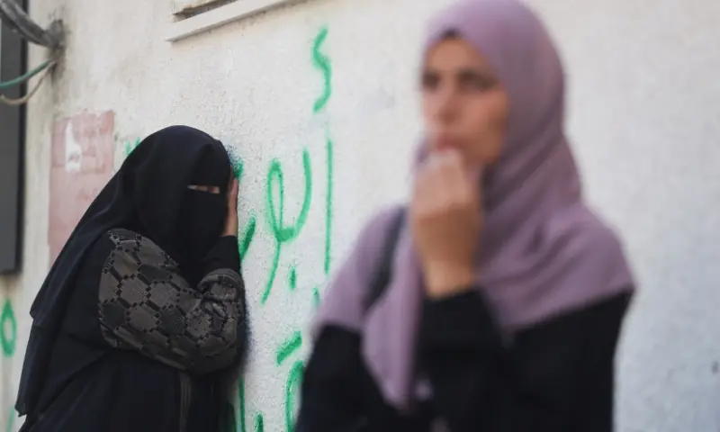 A mourner reacts during the funeral of Palestinians who were killed by Israeli fire while trying to receive aid and another killed in a strike on Friday, according to medics, at Al-Shifa Hospital in Gaza City, on August 30. &mdash; Reuters