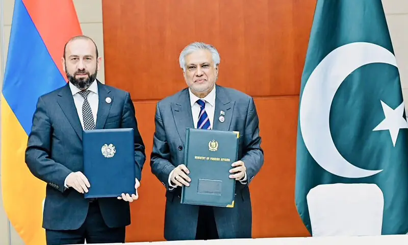 Armenian Foreign Minister Ararat Mirzoyan and Deputy Prime Minister and Foreign Minister Ishaq Dar exchange a joint communique establishing diplomatic relations in Tianjin, China on August 31. — X/@MIshaqDar50