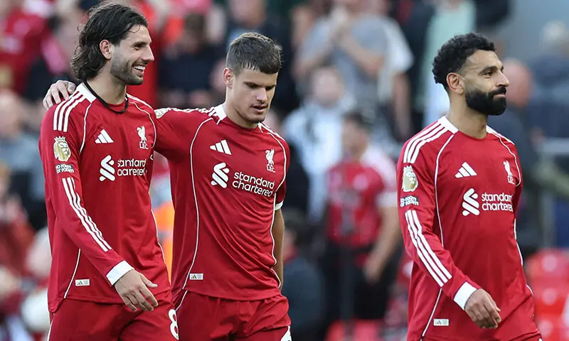 Liverpool’s Hungarian midfielder Dominik Szoboszlai (L) walks off with Liverpool’s Hungarian defender Milos Kerkez (C) and Liverpool’s Egyptian striker Mohamed Salah (R) at the end of the English Premier League football match against Arsenal at Anfield in Liverpool, northwest England on August 31. — AFP