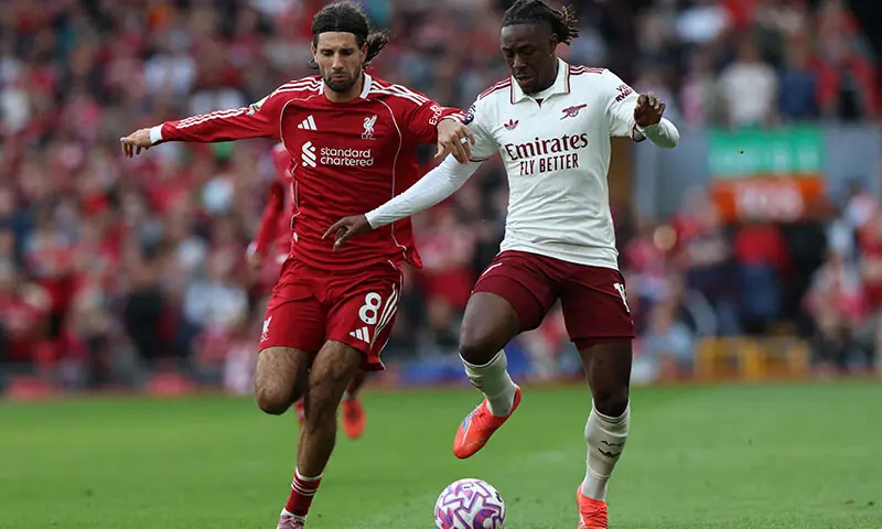 Arsenal’s English midfielder Eberechi Eze (R) is challenged by Liverpool’s Hungarian midfielder #08 Dominik Szoboszlai (L) during the English Premier League football match between Liverpool and Arsenal at Anfield in Liverpool, north west England on August 31. — AFP