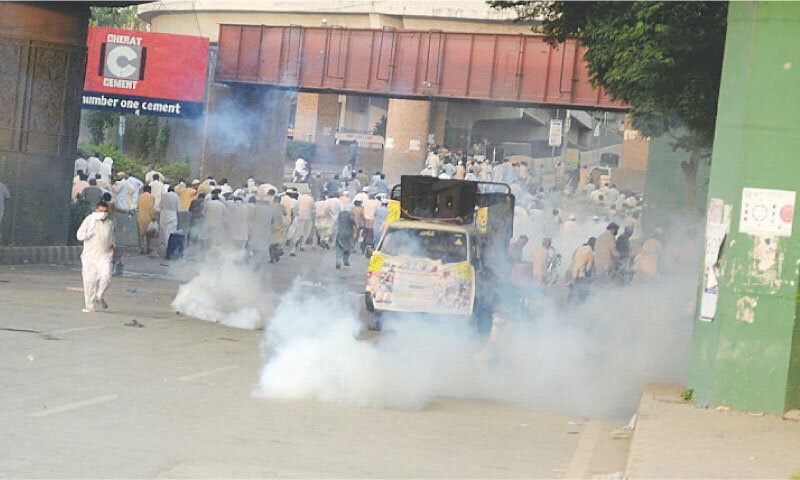 Police use tear gas to disperse government employees near Khyber Pakhtunkhwa Assembly building in Peshawar on Friday. &mdash; White Star
