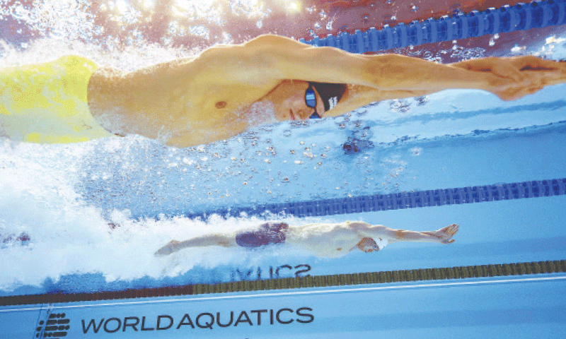 China&rsquo;s Qin Haiyang (bottom) and Aleksandr Zhigalov of Russia compete in the men&rsquo;s 200m breaststroke final at the World Aquatics Championships on Friday.&mdash;AFP