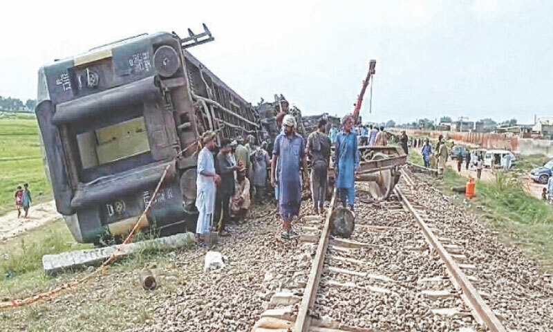 WORKERS repair a railway track in Kala Shah Kaku.&mdash;White Star