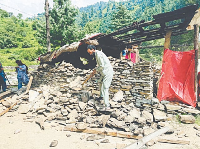 A house built along the river being voluntarily demolished by its owners in Siren Valley. &mdash; Dawn