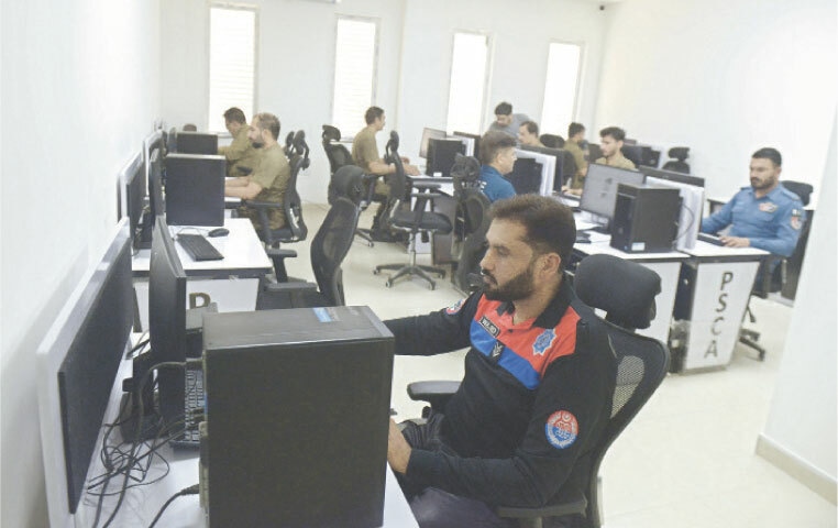  OfficialS of Dolphin Force, CCD, Traffic Police, Rescue 1122 and fire department monitor from the dispatch control and command room. 
