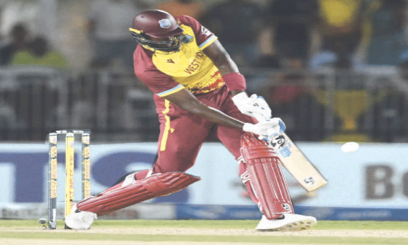 LAUDERHILL: West Indies batter Jason Holder hits a six during the second Twenty20 International against Pakistan at the Central Broward Park on Sunday.—AFP LAUDERHILL: West Indies batter Jason Holder hits a six during the second Twenty20 International against Pakistan at the Central Broward Park on Sunday.—AFP