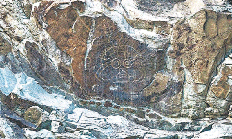 An iconic rock carving of the sun god on Helan Mountain.&mdash;Courtesy China Daily