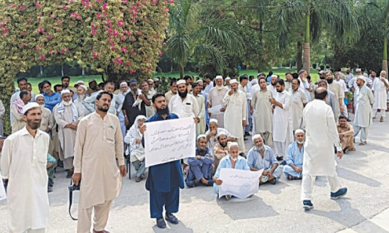 University of Peshawar employees stage a protest in front of the administration office on Monday. &mdash; White Star