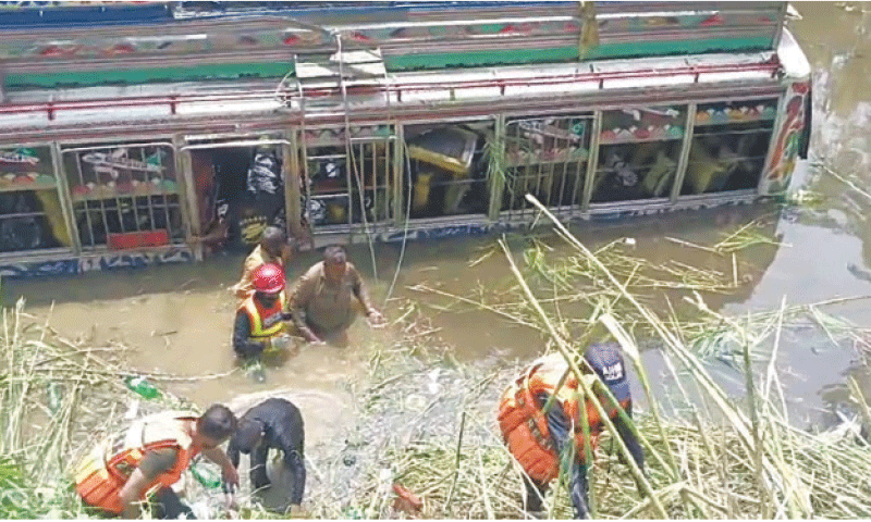 Two persons died and 13 others were injured when a speeding bus plunged into a pond near Ahmedabad Town on Tuesday. &mdash; Dawn