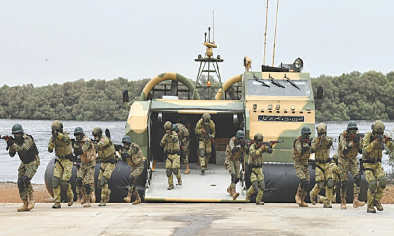 Members of Pakistani and Turkish special forces exit a hovercraft as they take part in an amphibious operation exercise, which concluded in Karachi on Wednesday.&mdash;Dawn