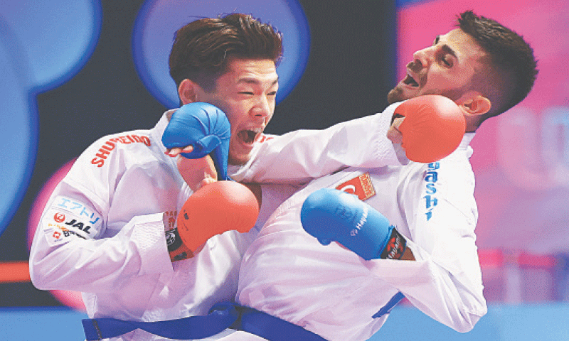 CHENGDU: Japan&rsquo;s Hiromu Hashimoto (L) fights with Turkey&rsquo;s Eray Samdan during the karate men&rsquo;s kumite 60kg gold medal match at the World Games on Friday.&mdash;Reuters
