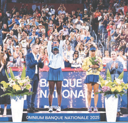 MONTREAL: Victoria Mboko of Canada lifts the trophy after winning the Canadian Open final against Japan&rsquo;s Naomi Osaka at the IGA Stadium.&mdash;AFP