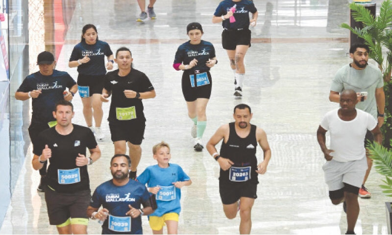 People take part in Dubai Mallathon at the City Centre Mirdif mall in Dubai.&mdash;AFP