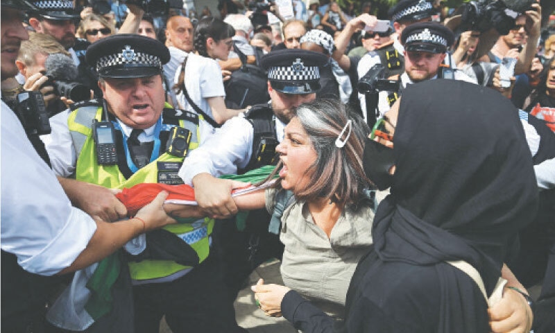 Police arrest protesters at a demonstration in support of the Palestine Action group in London.&mdash;AFP