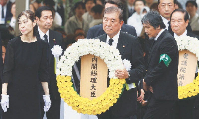 PRIME Minister Shigeru Ishiba of Japan offers a flower wreath for the victims of the 1945 atomic bombing of Nagasaki, during a ceremony commemorating the 80th anniversary of the attack.&mdash;Reuters