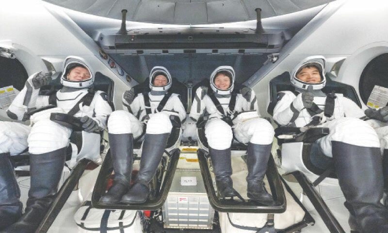 San Diego: An international crew of four astronauts &mdash; (from left) Kirill Peskov of Russia, Nasa astronauts Nichole Ayers and Anne McClain, and Takuya Onishi of Japan &mdash; snapped inside their spacecraft upon return to Earth after five months aboard the International Space Station.&mdash;AFP  Report
