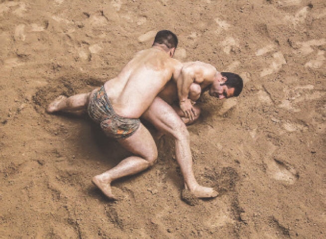  Wrestlers spar at an akhaarra in Lahore | Murtaza Ali/White Star 