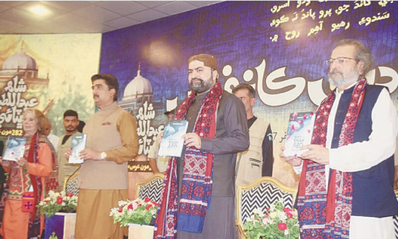 Balochistan Chief Minister Mir Sarfraz Bugti (2nd from right) holds a book The Poetry of Shah Abdul Latif at its launch at Adabi conference in Bhit Shah on Sunday.—Photo by Umair Ali Balochistan Chief Minister Mir Sarfraz Bugti (2nd from right) holds a book The Poetry of Shah Abdul Latif at its launch at Adabi conference in Bhit Shah on Sunday.—Photo by Umair Ali