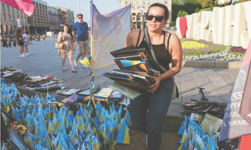 Kyiv: A Colombian nurse, who currently works in Bucha on the outskirts of Kyiv, carries photos of some of the hundreds of her compatriots who have died fighting for Ukraine in the ongoing conflict with Russia. A group of relatives arranged a memorial for fallen soldiers on Independence Square on Sunday.&mdash;Reuters
