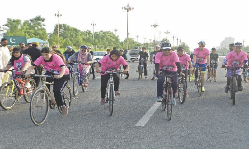 Cyclists set off from D-Chowk during the Azadi Championship in Islamabad on Sunday. — Photo by Mohammad Asim Cyclists set off from D-Chowk during the Azadi Championship in Islamabad on Sunday. — Photo by Mohammad Asim