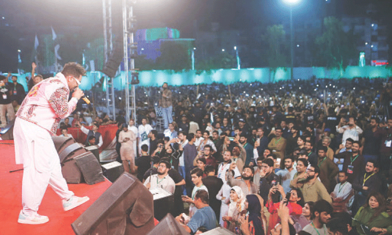 A SINGER enthrals the audience at the programme.&mdash;Dawn