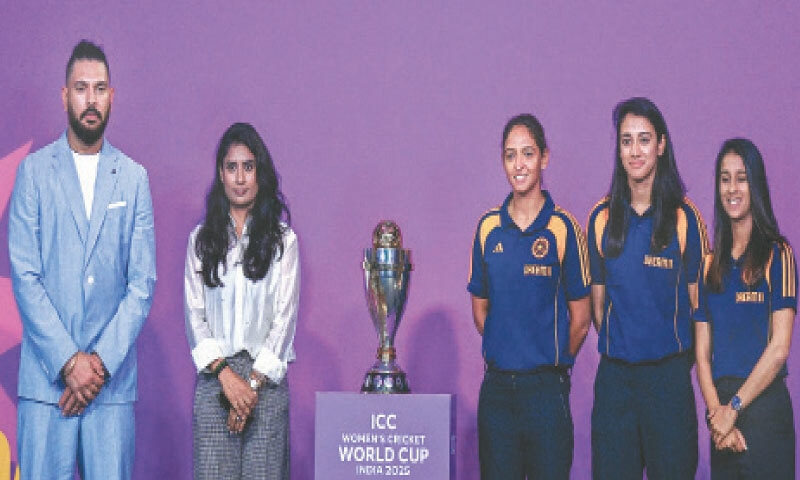 INDIAN women cricket team players Jemimah Rodrigues (R), Smriti Mandhana (second R) and Harmanpreet Kaur (C) pose with the trophy alongside former Test batter Yuvraj Singh during an event held on Monday to mark the 50-day countdown to the ICC Women&rsquo;s World Cup.&mdash;AFP