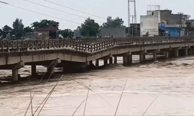 NAROWAL: The bridge on Zafarwal-Sialkot road collapsed on Tuesday after 22,000 cusecs of floodwater passed through Nullah Dek. &mdash; Dawn
