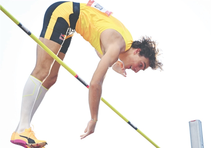 BUDAPEST: Sweden&rsquo;s Armand Duplantis clears the bar during the pole vault event at the Hungarian Grand Prix.&mdash;AFP