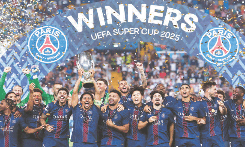 Paris Saint-Germain players celebrate with the trophy after beating Tottenham Hotspur in the UEFA Super Cup final at the Friuli Stadium.&mdash;AFP