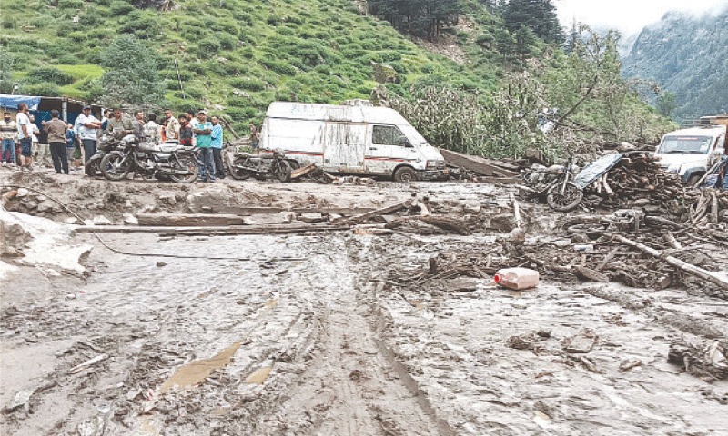 Rescuers inspect the site of a flash flood at a village in Kishtwar district on Thursday.&mdash;AFP