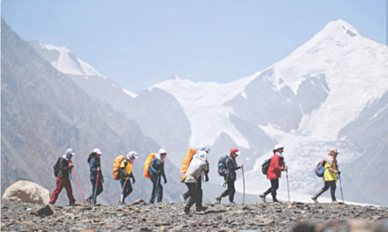 Women trekking team on its way back to Chitral. &mdash; Dawn