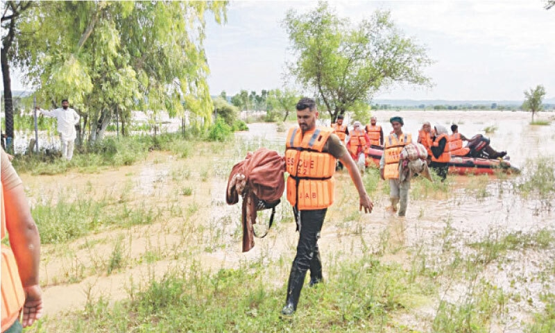 A file photo of Rescue 1122 personnel during the recent flash floods in Jhelum. Capacity building can help improve the efficiency of the staff. &mdash; File photo