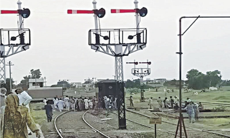 The broken down Attock Railcar waits for a relief engine at Jand railway station. &mdash; Dawn