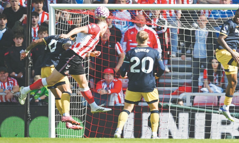 SUNDERLAND: Sunderland’s Daniel Ballard (second L) heads to score during the Premier League match against West Ham United at the Stadium of Light on Saturday.—AFP