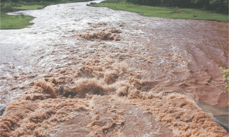 Water level increases in Korang Nullah after heavy rains in Rawalpindi and Islamabad on Sunday. &mdash; Online