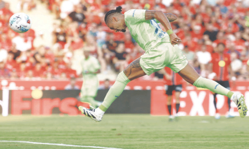 MALLORCA: Barcelona&rsquo;s Raphinha heads to score during the La Liga match against Mallorca at Mallorca Son Moix Stadium.&mdash;AFP